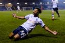 Bury forward Nicky Maynard celebrates after being involved in scoring the winning goal during the Sky Bet League 2 match between Bury FC and MK Dons. Picture by Andy Whitehead