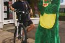 Simon Baker of Bolton Lads and Girls Club, in costume, with Keiran Stewart, promoting the bike ride to Abersoch