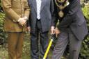 The Mayor of Bury, Councillor Farook Chaudhry performs the groundbreaking ceremony that will give Bury's famous Fusiliers a new home. With him are (left) Colonel Brian Gorski, the museum's fundraising manager, and Coun Bob Bibby, leader of Bury Council