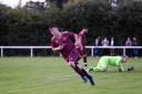 Matty Williams wheels away in celebration after scoring the first goal for the phoenix club