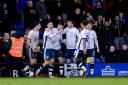 Bury midfielder Jay O'Shea is congratulated by Bury team mates after putting his side 1-0