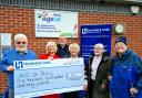 Marketing manager at Horsfield and Smith, Jane Hawarden, second right, hands over the cheque to Age UK Bury members, including CEO Andy Hazeldine