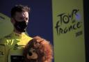 Britain's Adam Yates, wearing the yellow jersey of the overall leader, stands on the podium after completing the fifth stage of the Tour de France cycling race over 183 kilometers (113,7 miles) with start in Gap and finish in Privas, southern France,