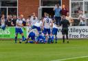 PILE ON: Bury AFC celebrate a goal in the 2-1 win against North Shields Picture: Phil Hill