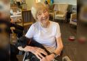 Resident Marjory with Jesse, the therapy dog