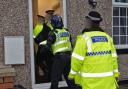 Police raid a home in Bury
