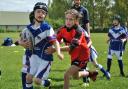 Bury Broncos newly-formed under-7s rugby league team, in blue, take their first run out at Philips High School in Whitefield against Cadishead Rhinos. The youngsters had a fun-filled morning with parents encouraging all the kids as they learned new