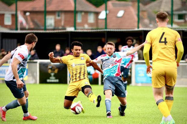 On the ball: Radcliffe’s Jack Baxter in action at Basford. Picture by Hayden Roberts