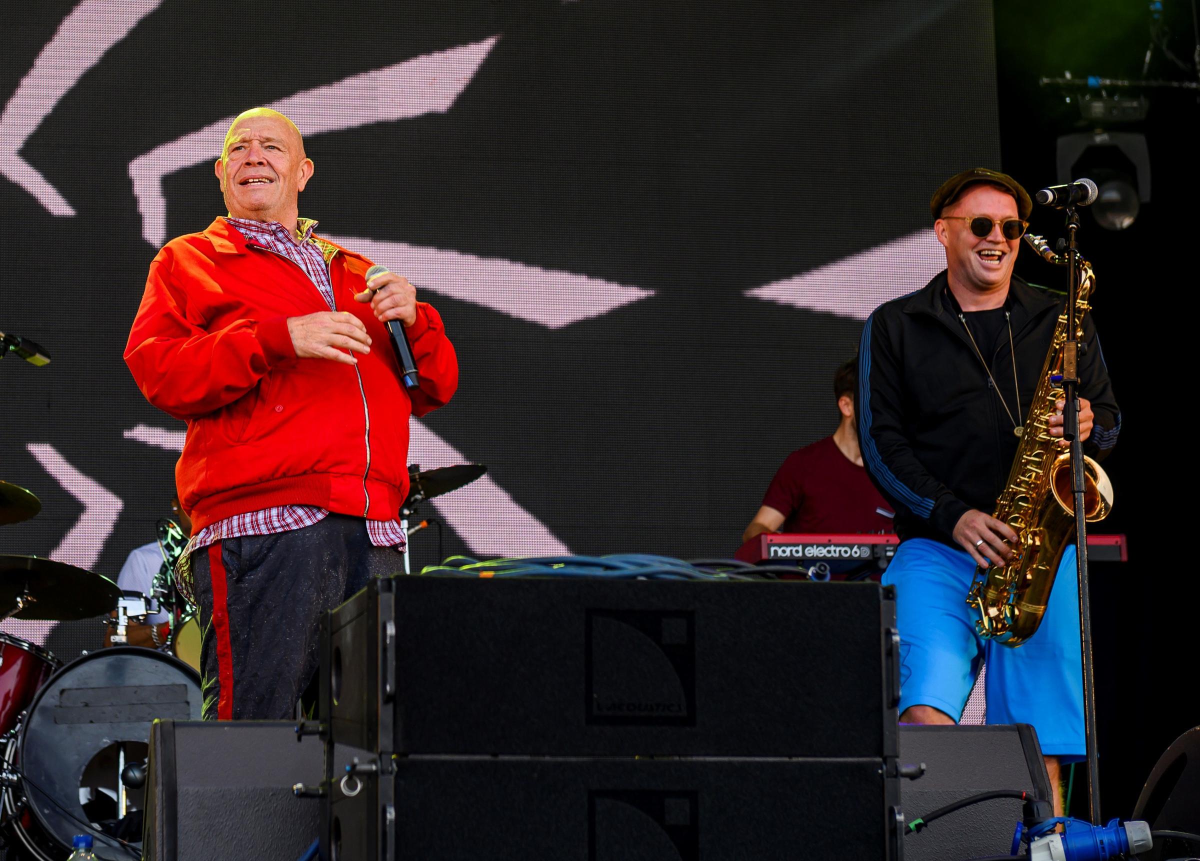 Buster Bloodvessel on stage with Bad Manners