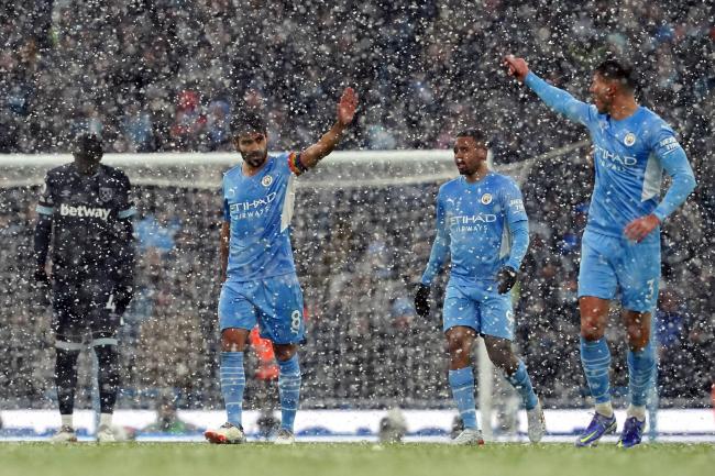 Manchester City weathered the snow to claim a hard-fought win over West Ham