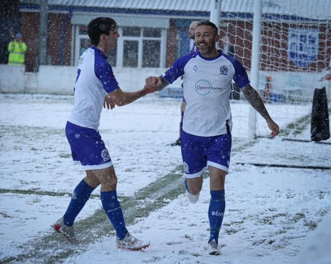 DOUBLE DELIGHT: Tom Greaves scores one of his two goals in AFC's 5-1 win over Cleator Moor Celtic on a snow covered Neuven Stadium Picture: Danny Wood