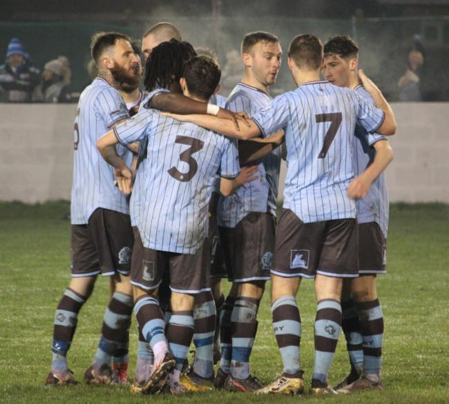 TOGETHER: Bury AFC players celebrate one of their goals in Tuesday’s 3-1 win at Ashton Town Pictures: Malcolm Parr