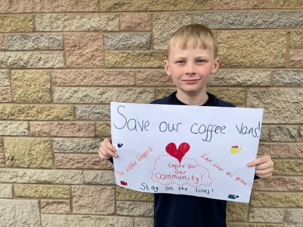 Bury Times: Nine-year-old Will Talbot with a display of support for the coffee vans