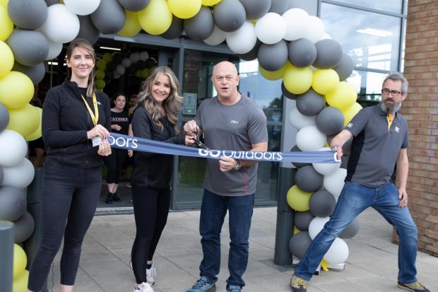 Bury Times: Helen Skelton and Ross Kemp cutting the ribbon at the shop