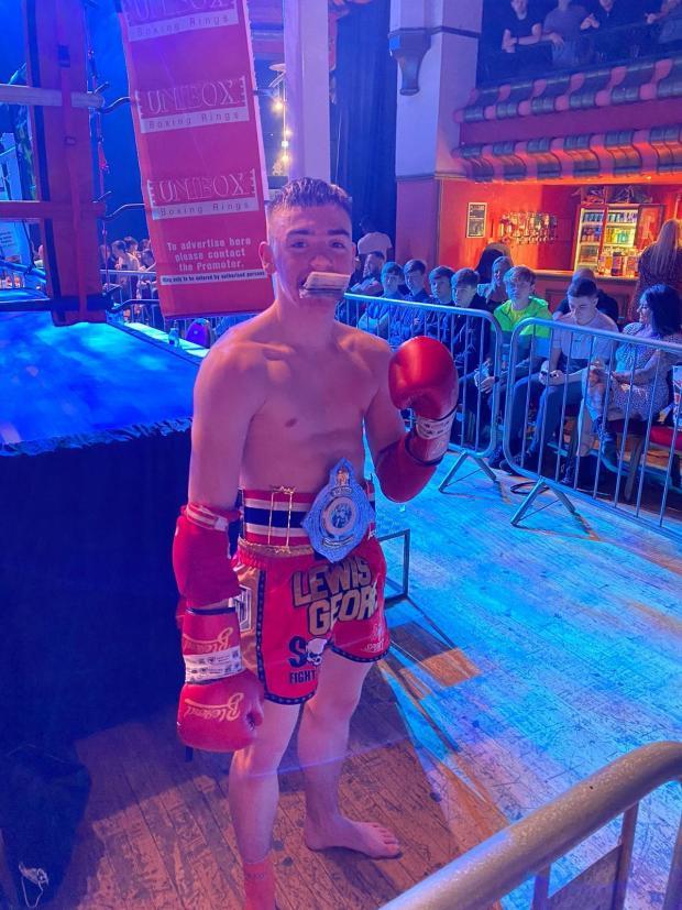 Bury Times: Lewis George after winning the World Muay Thai British title