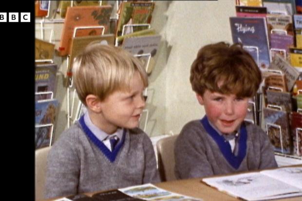Two school boys talking about the moon in a BBC Archive video