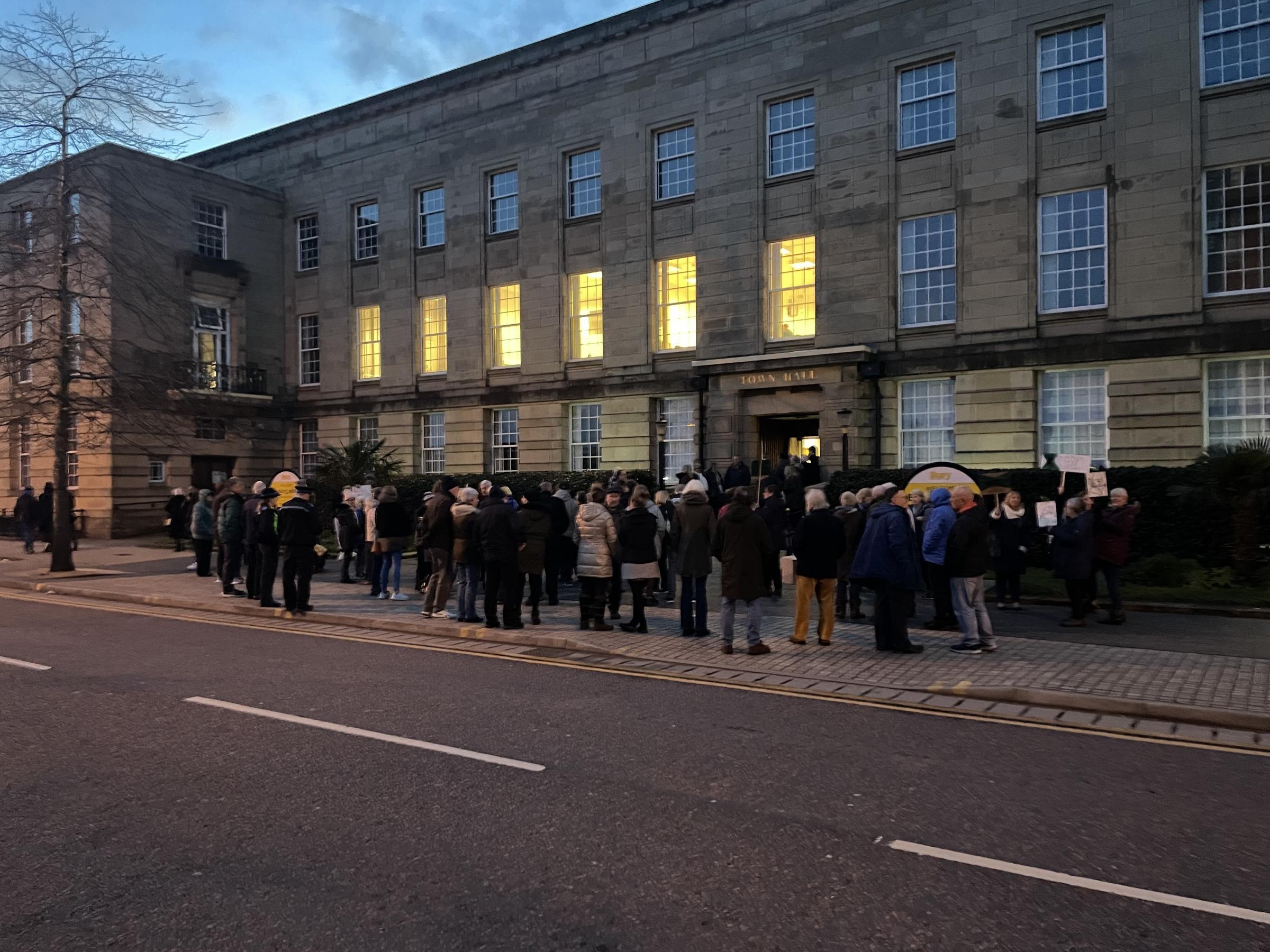 Protesters outside the town hall