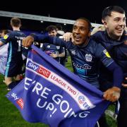 Neil Danns celebrates Bury's promotion
