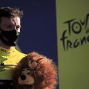 Britain's Adam Yates, wearing the yellow jersey of the overall leader, stands on the podium after completing the fifth stage of the Tour de France cycling race over 183 kilometers (113,7 miles) with start in Gap and finish in Privas, southern France,