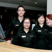 BIG PLANS: Smiling staff at the restaurant reception area. of The Chinese Buffet, Bridge Street, Bolton