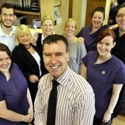 EXCELLENCE: Dr Michael Cahill, centre, with staff at Cahill Dental Centre, Higher Bridge Street, Bolton