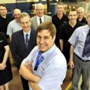 MOVING FORCE:  Managing director Tim Entwistle with some of his work team at Movetech