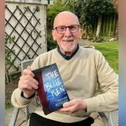 Author Michael Knaggs with a copy of The Blue Men