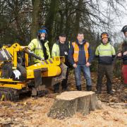 Cllr Alan Quinn, centre, with the council's tree team and the new machinery