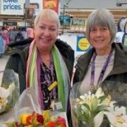 Chris Green and Jackie Hughes with flowers donated from Tesco