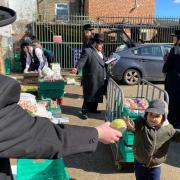 Jewish volunteers distribute food packages to families ahead of Passover two years ago