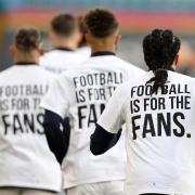 'Football is for the fans' shirts on display
