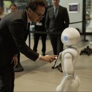 Viscount Camrose, Minister for AI and Intellectual Property meets humanoid robot Pepper at Manchester University Engineering Building on August 30 (Picture: DSIT)