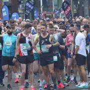 Thousands of runners cheered on by friends and family in town's biggest run