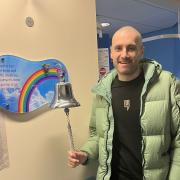 Mitch Gowing rings the end of treatment bell