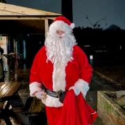 The Lamppost Cafe co-owner Mark Wellman-Riggs in a Santa suit