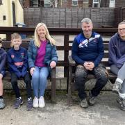 Junior players Jack Boulton and Joey Brookfield, committee members Jenny Brookfield and Wayne Jackson, and senior player Olivia Kay where the new members' lounge will be built
