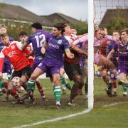 Heys and Bury players battle for possession in the visitors six-yard box Pic Martin Ogden
