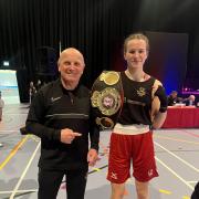 Coach Adrian Fleming and Ella Thompstone after her national success
