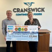 Phil Fellone, from the Made In Bury team, and draw winner Laura McMahon with her giant cheque