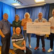 The event raised thousands for the Manchester and district branch of the Motor Neurone Disease Association. Former secretary Jed Stoney, sat down, has motor neurone disease