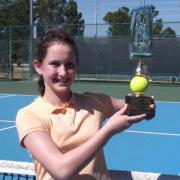 Natalie Flinn proudly displays her trophy after winning the Lake Cane Championships in Orlando, Florida