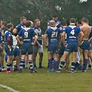Bury Broncos hold an impromptu team meeting on the pitch following defeat at Leigh Miners Rangers A