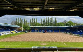 Work is ongoing at Gigg Lane to install the new surface