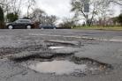 COST: One of many potholes that have blighted Bury's roads